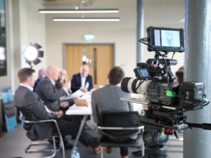 The camera shot of the roundtable event